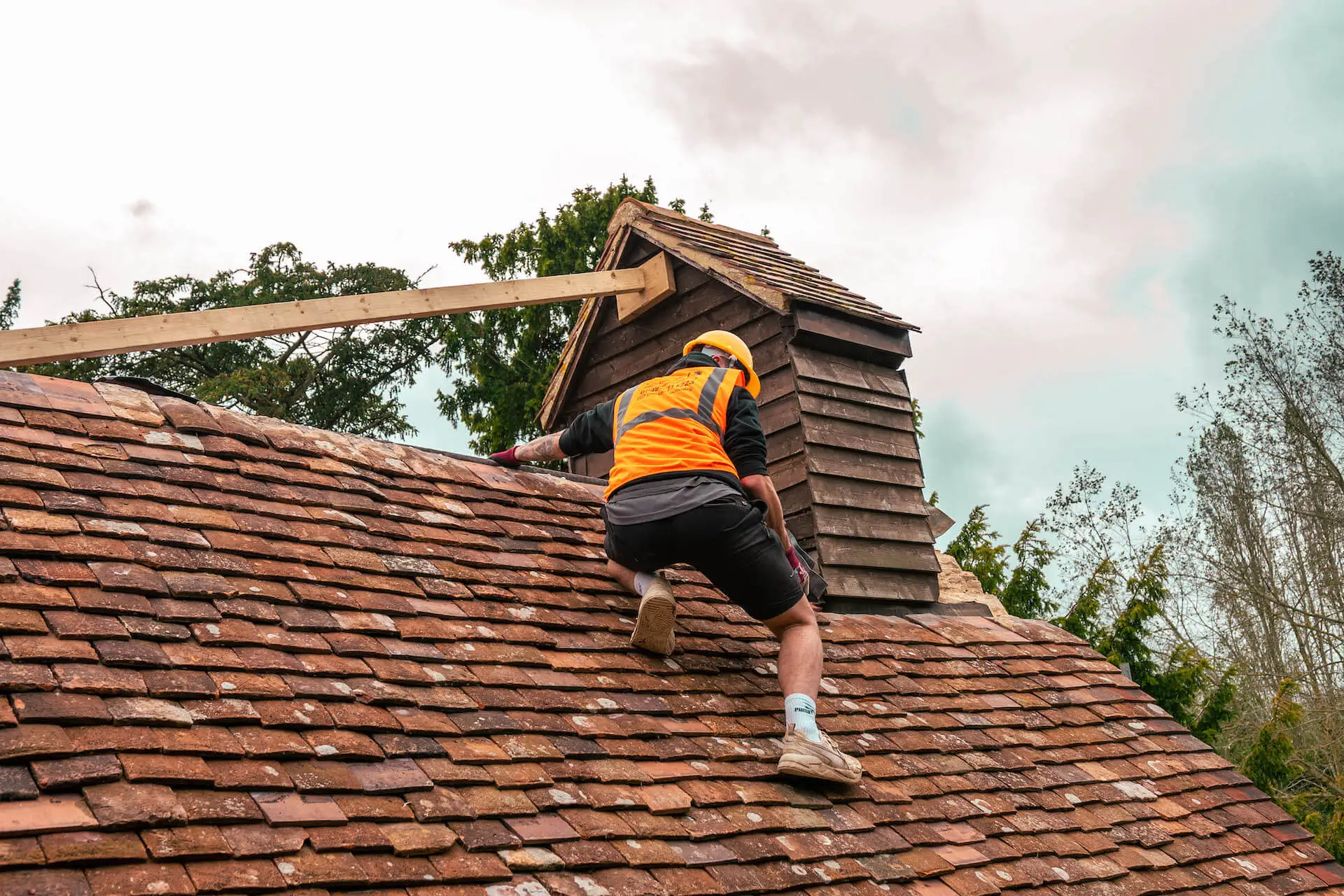 Fallen ridge tiles after high winds on a pitched roof
