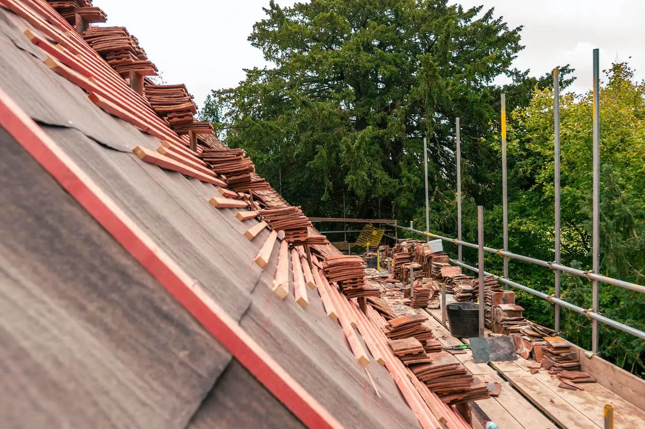 Broken skylight on a pitched roof after weather damage