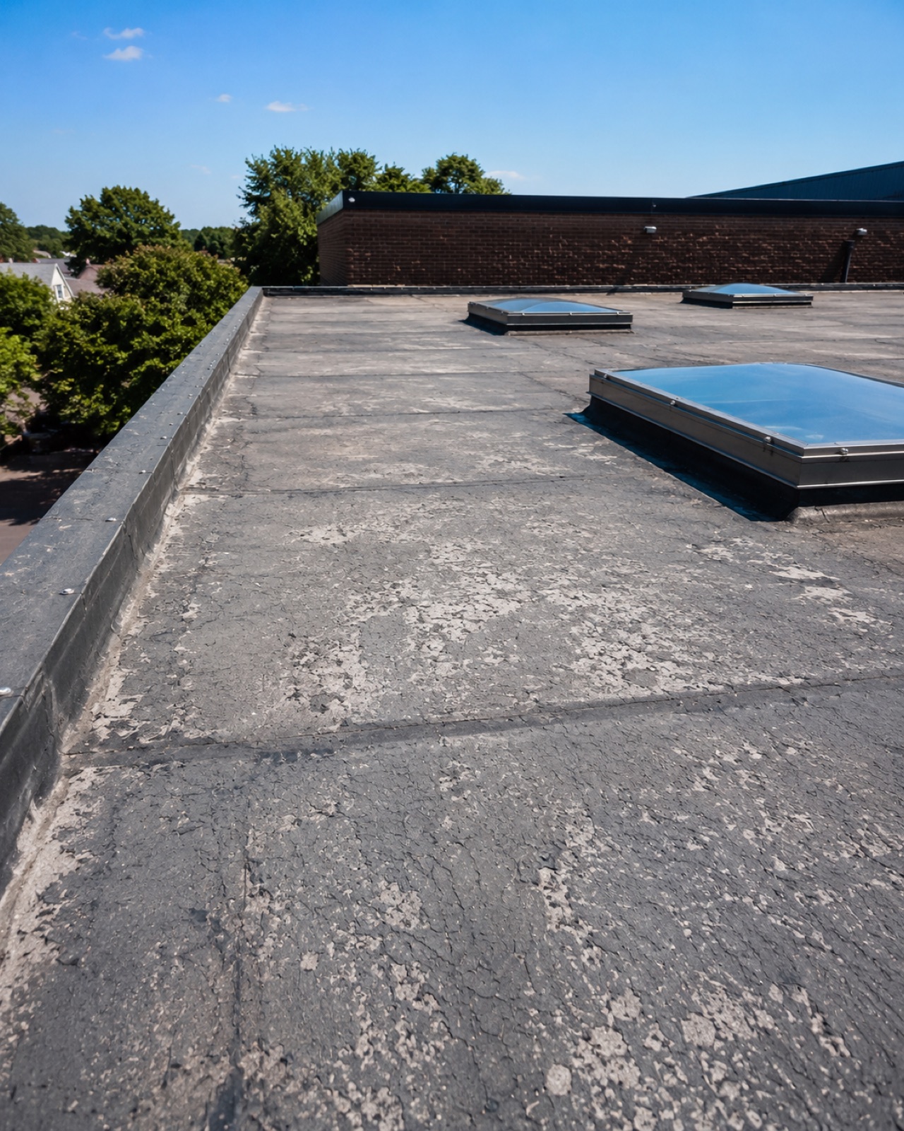 UV degraded flat roof cap sheet at end of life
