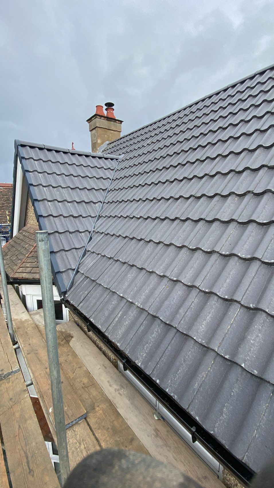 Completed Bedford re-roof in interlocking tile with renewed roofline