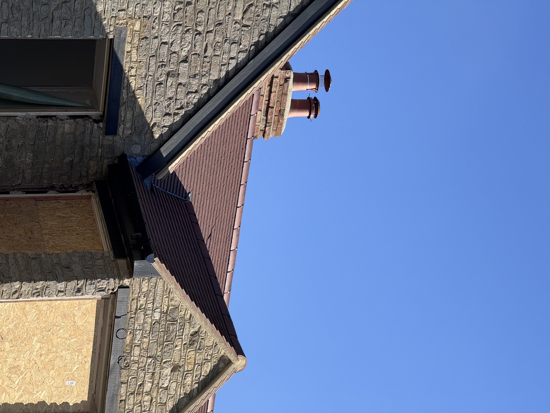 New lead flashing and soakers dressed around a rebuilt chimney stack in Buckinghamshire